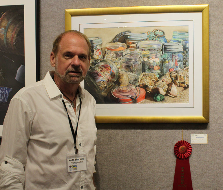 Keith Shebesta with his 2nd place painting "Collector's Collention"